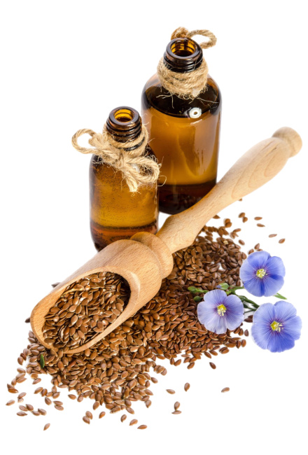 Leinöl-Flasche mit Leinsamen und Flachsblüten